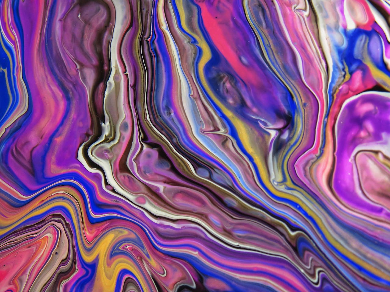 A dynamic and colorful abstract painting with swirling acrylic patterns in vivid hues.